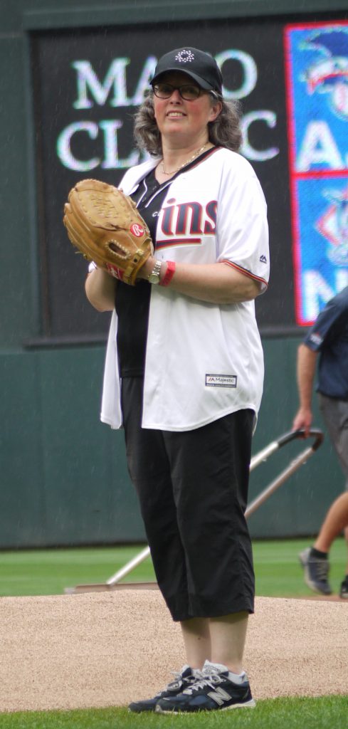 Woman on pitchers mound with Twins shirt