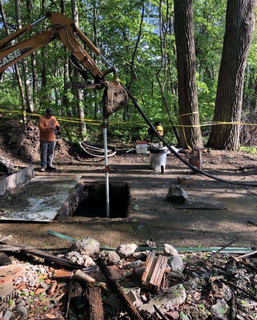 Photo of the neat cement being pumped into the bottom of the well. The contractors used a 2-inch diameter tremie pipe to place the neat cement.